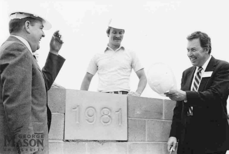 Photograph of George Mason University President Johnson and Til Hazel on construction site for a university building, 1981.
