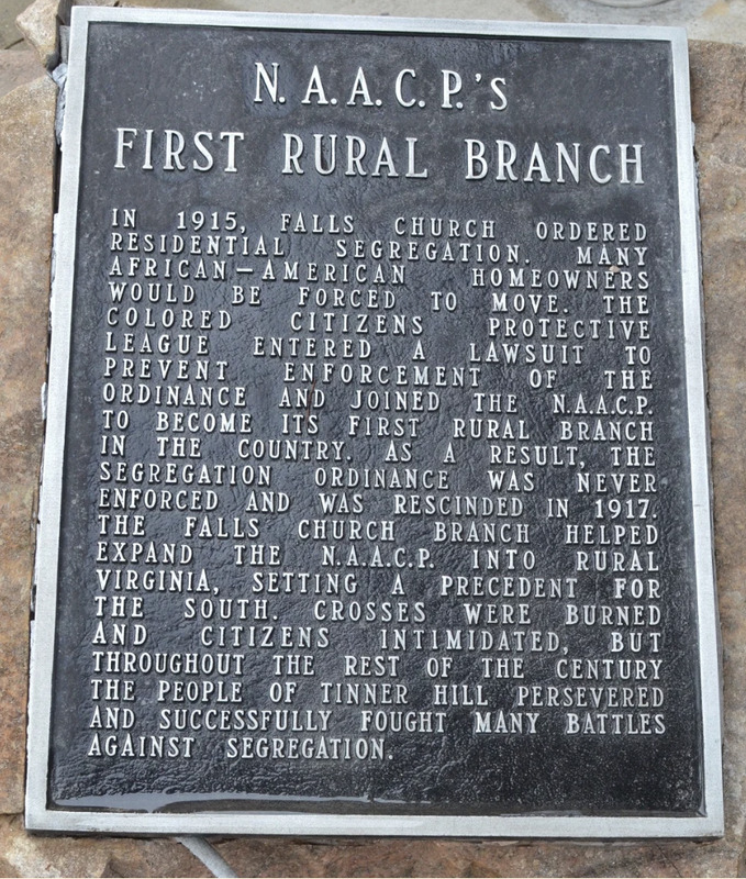 Close up on monument marker titled "NAACP's First Rural Branch".