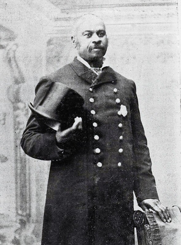 Portrait of John A. Seaton standing in front of a portrait background circa 19th century.