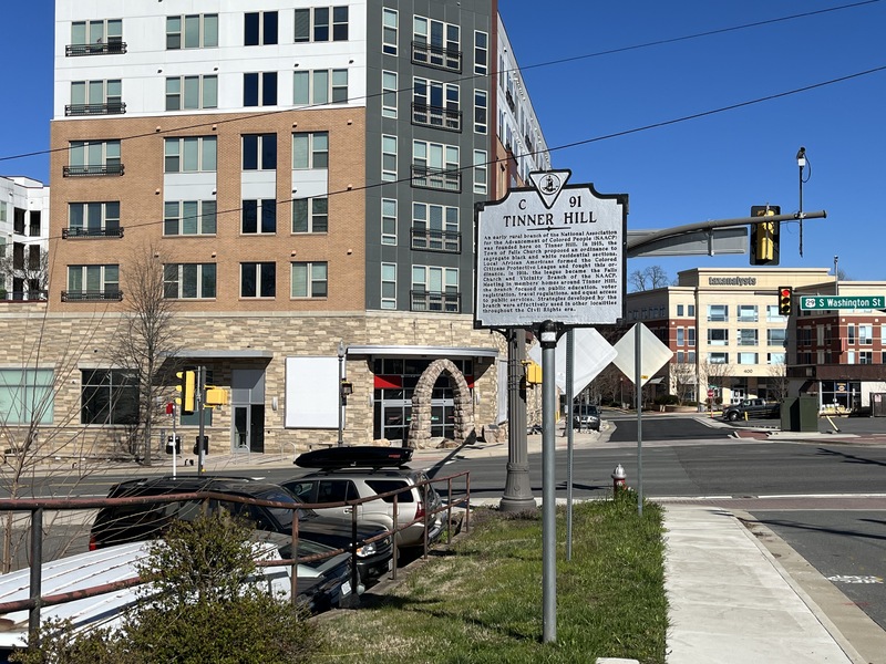 Picture of Tinner Hill Historic Plaque and monument in front of apartment_close