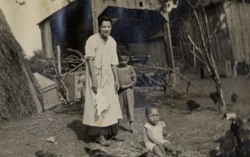 Photograph of Mary Ellen Henderson and her children: James Henderson (seated) and Edwin (“E.B.”) Henderson circa 1918.