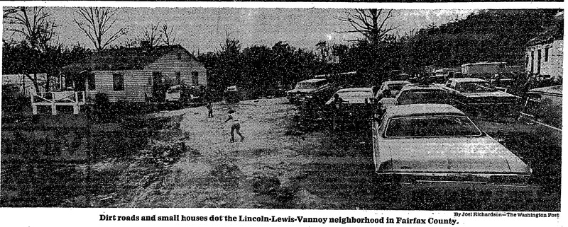 Small homes and broken cars line LLV dirt road