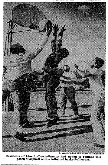 Boys playing basketball on a small court in LLV