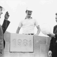 Photograph of George Mason University President Johnson and Til Hazel on construction site for a university building, 1981.