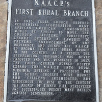 Close up on monument marker titled "NAACP's First Rural Branch".