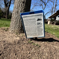 Tinner Hill Historic Site board next to tree