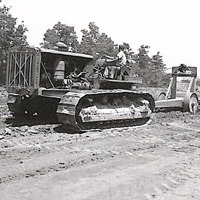 Bulldozer working on a dirt road in Fairfax County, post World War II.