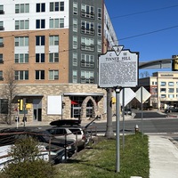 Picture of Tinner Hill Historic Plaque and monument in front of apartment_close
