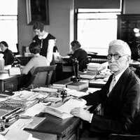 Black and white portrait of Walter A. Plecker sitting at a desk in an office setting, circa 1935.