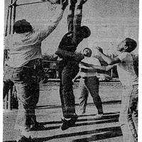 Boys playing basketball on a small court in LLV